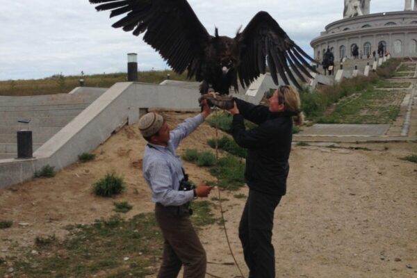 Holding-a-vulture-in-Mongolia-1-scaled